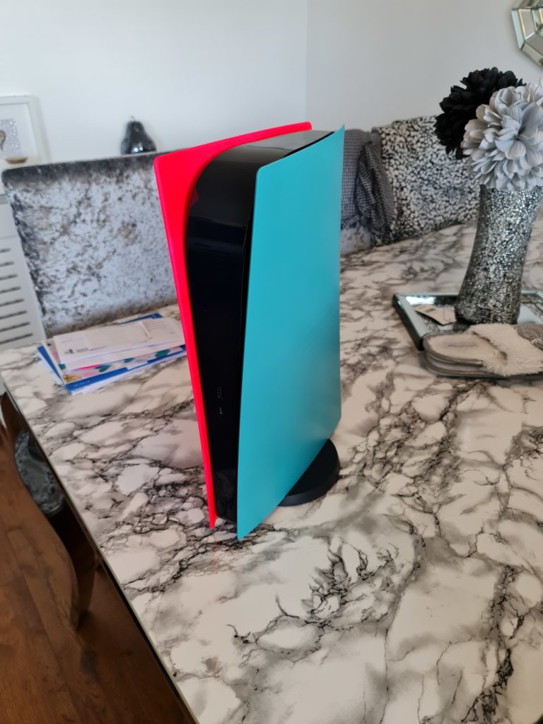 ps5 with pink and turquoise coloured plates